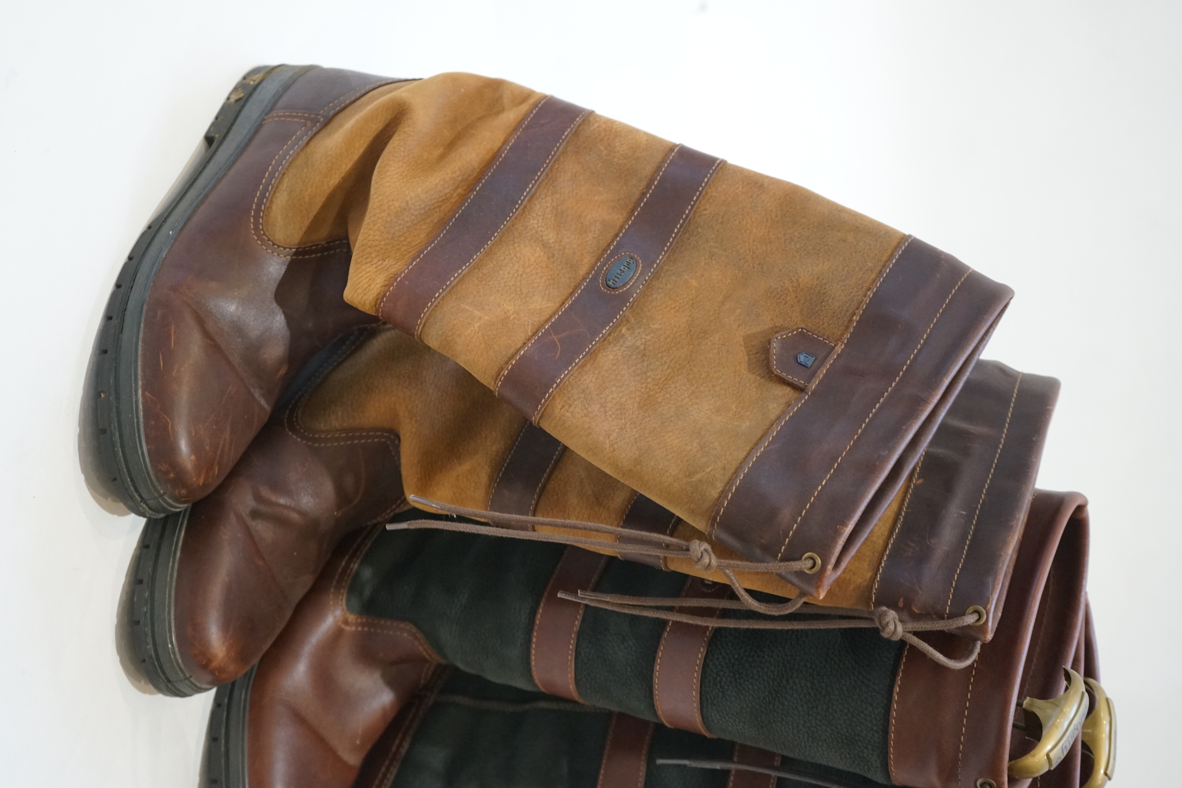 A large Dubarry leather travel bag and two pairs of gentleman's Dubarry brown leather boots, size 8.5/9